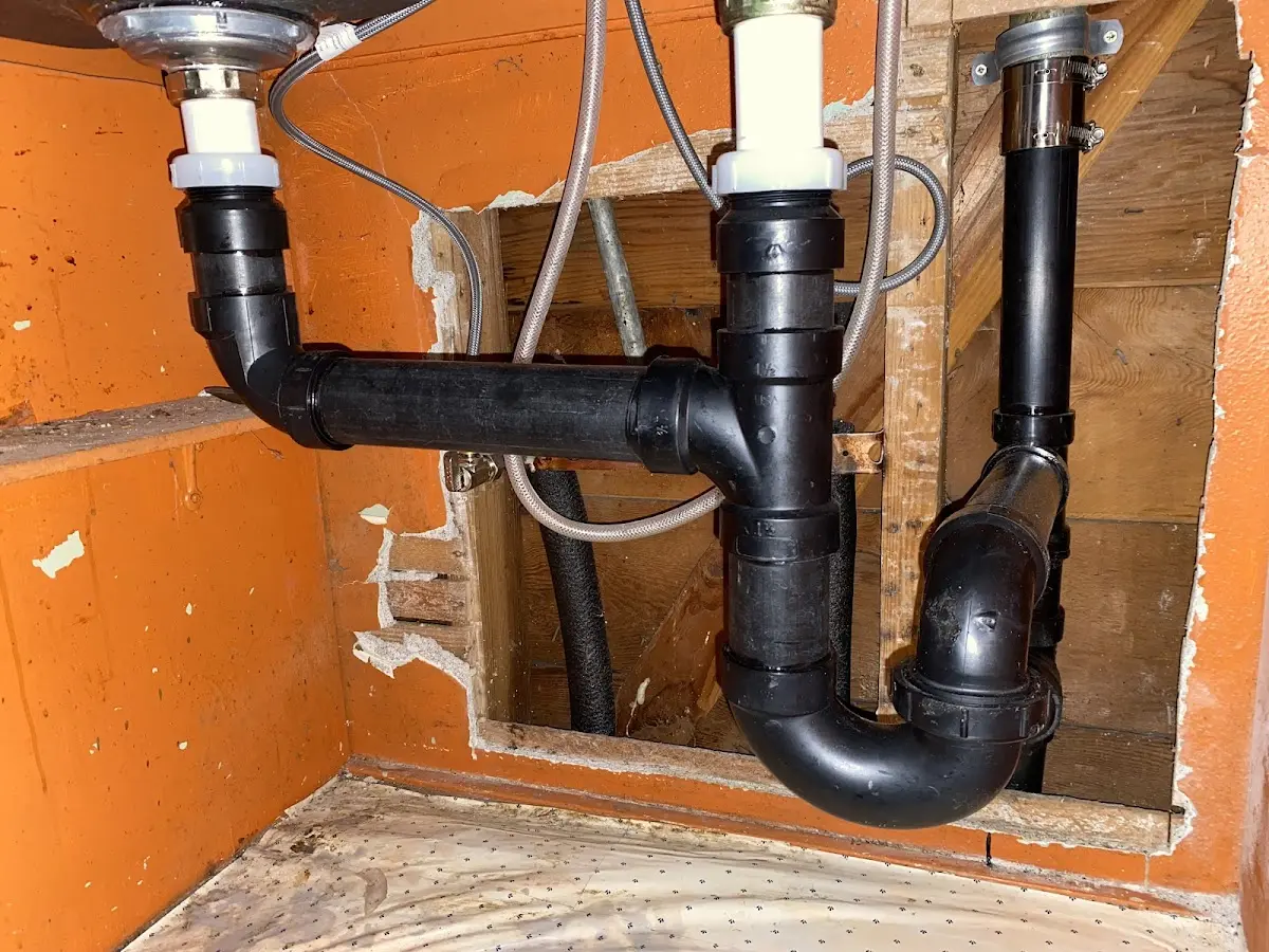 Professional Garbage Disposal Repair equipment and tools on the job in North Miami